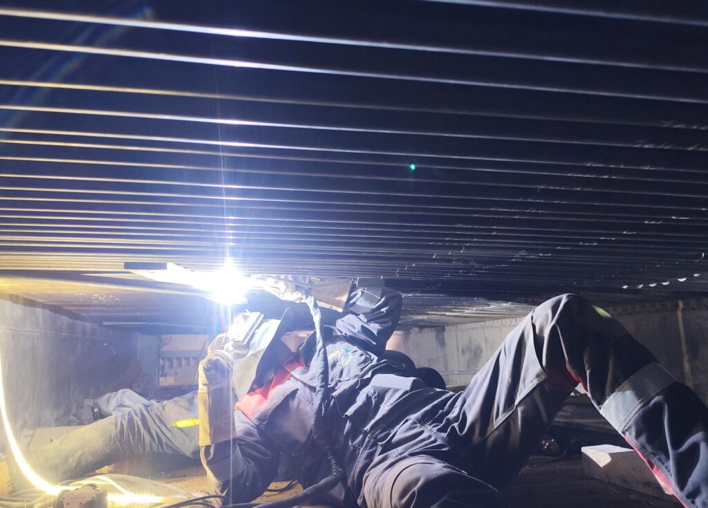 Industrial welding work on a recovery boiler floor – PRO-Welding Industry Services