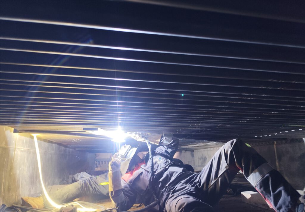 Overhead welding works performed in confined space inside an industrial boiler – PRO-Welding Industry Services